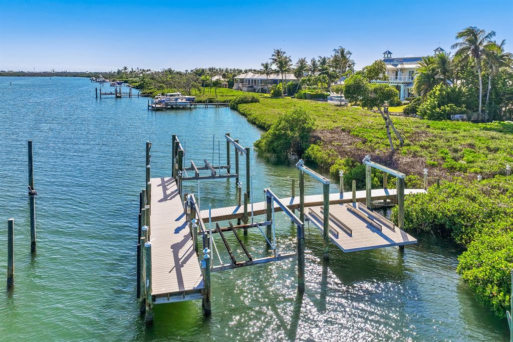 4070 Loomis Avenue Boca Grande, FL 33921 - Photo 57 of 59 a view of a lake with a house in the background