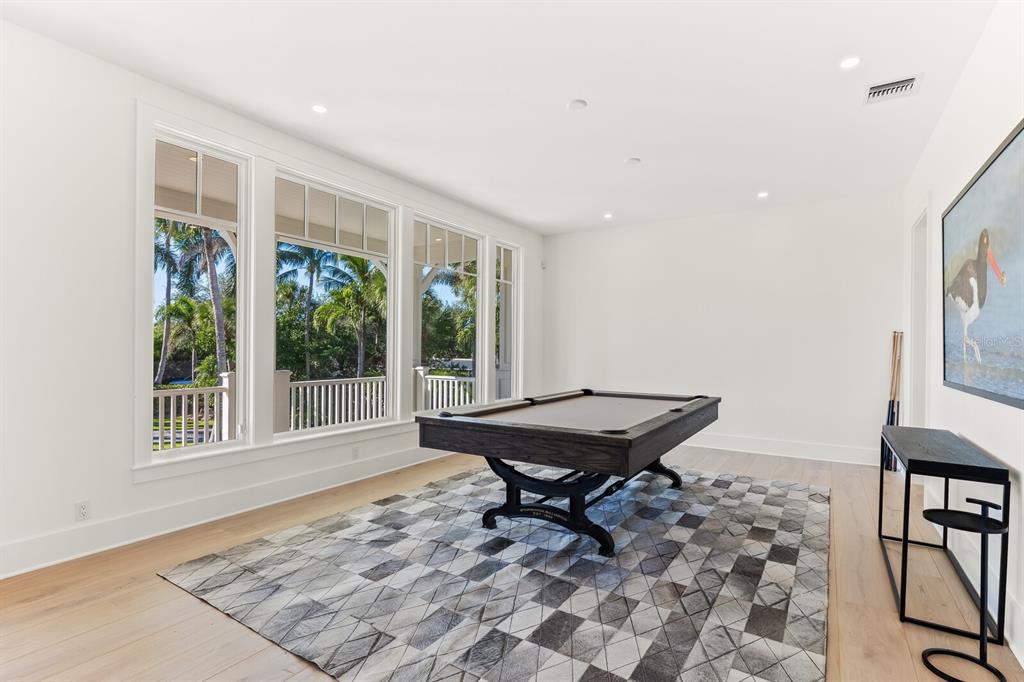 4070 Loomis Avenue Boca Grande, FL 33921 - Photo 10 of 59 a view of a room with furniture wooden floor and windows