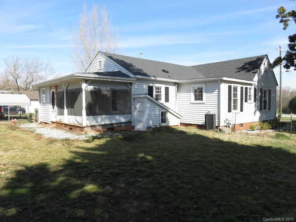 8635 Woodleaf Road Woodleaf, NC 27054 - Photo 22 of 24 a front view of a house with a yard