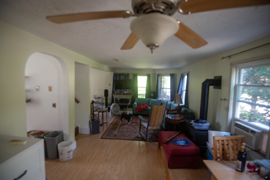 920 Worcester Road Barre, MA 01005 - Photo 19 of 40 a living room with furniture a chandelier fan and a window