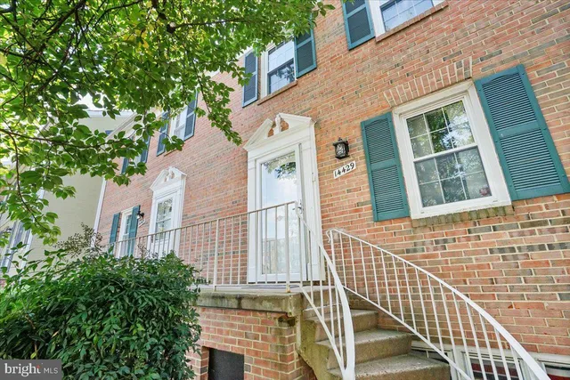 a view of a brick building next to a building