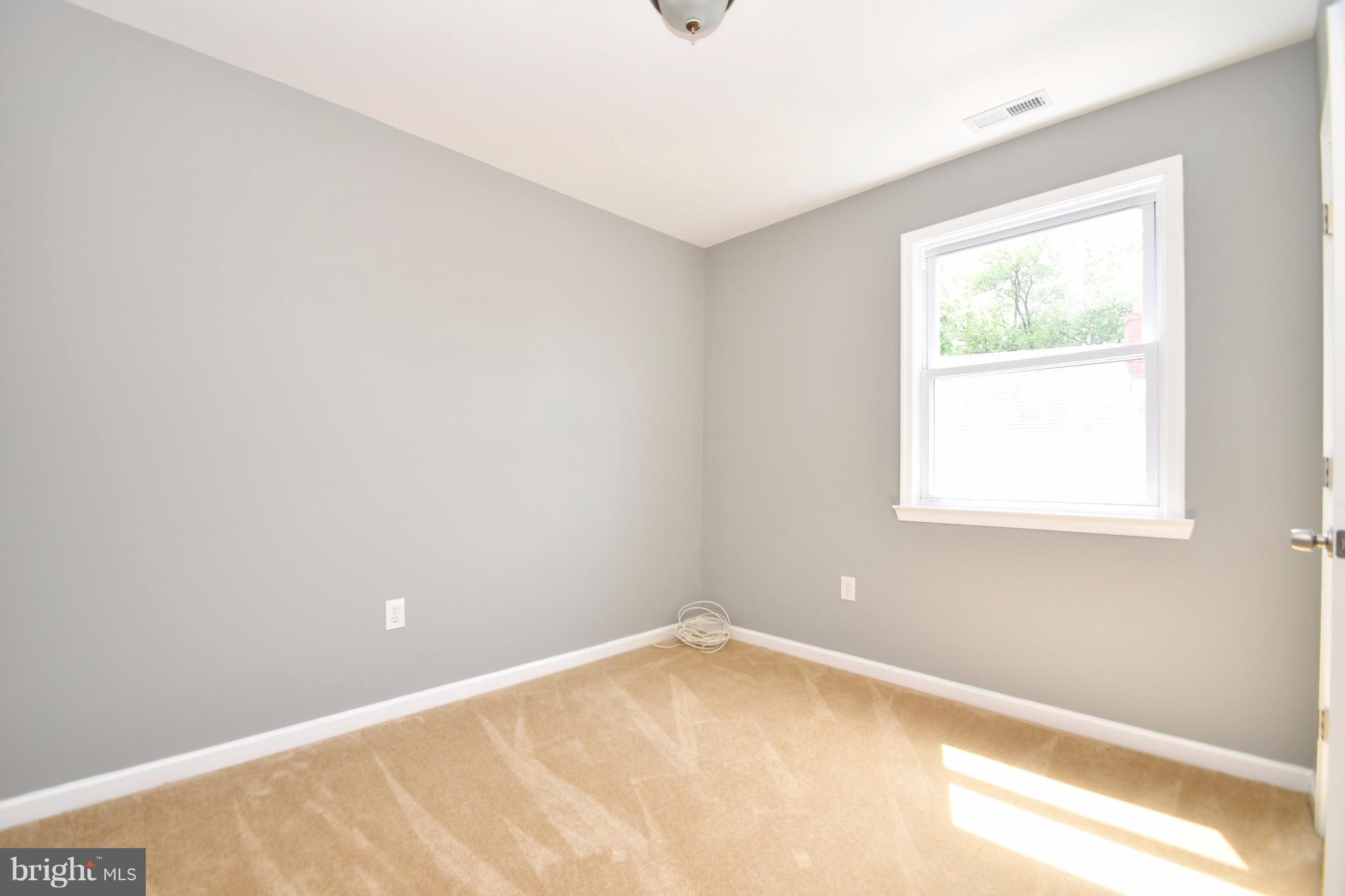 8209 Northview Road Baltimore, MD 21222 - Photo 22 of 30 a view of an empty room with a window