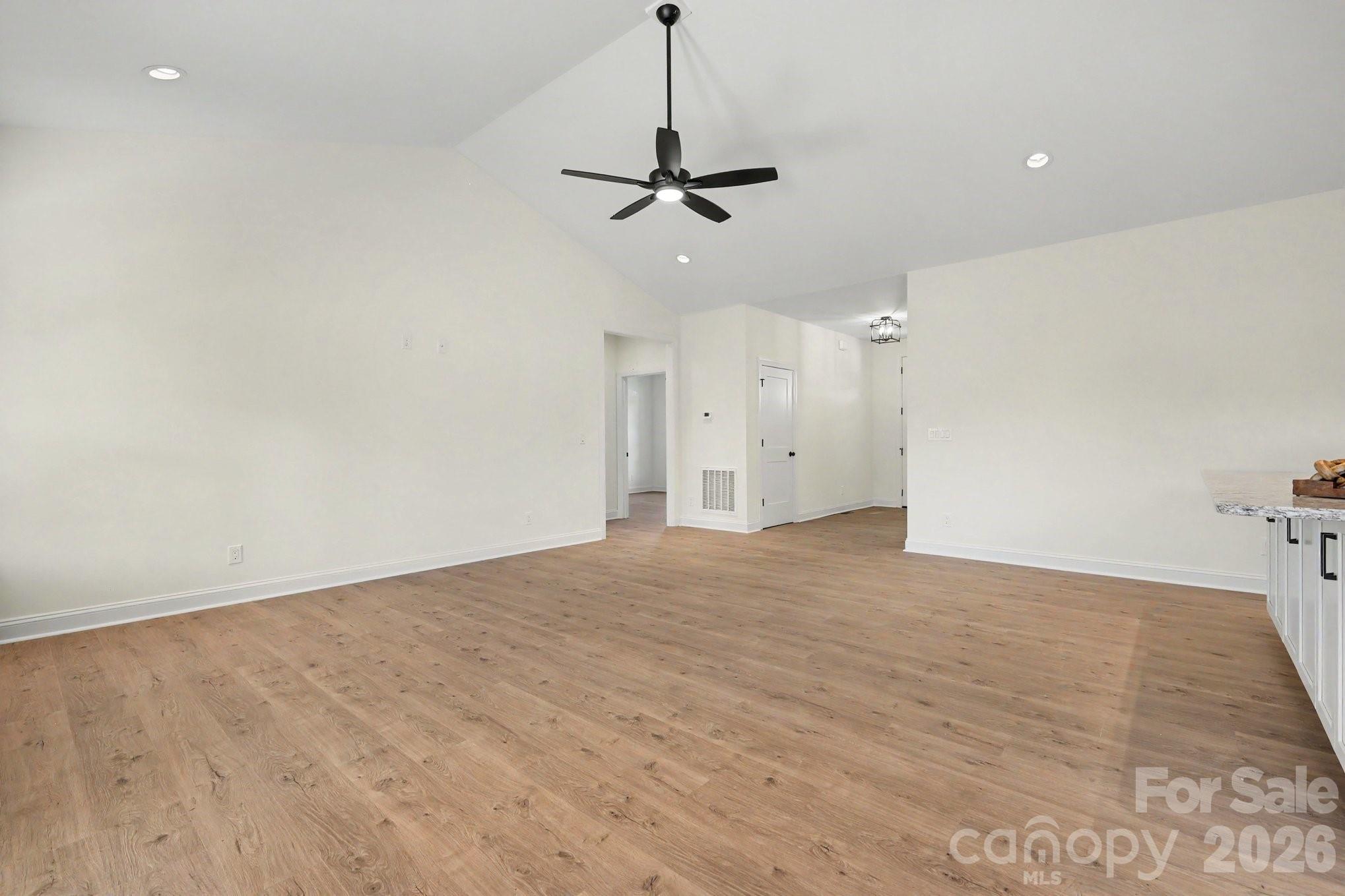190 Goodnight Road Salisbury, NC 28147 - Photo 9 of 35 a view of a livingroom with a ceiling fan window and a ceiling fan