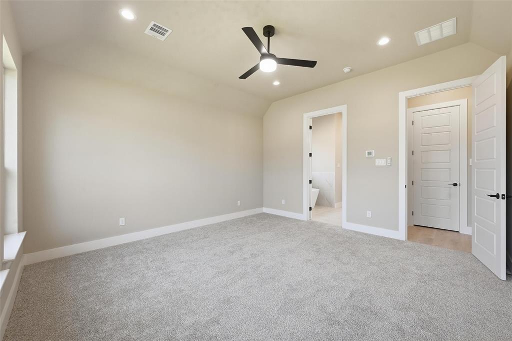 1053 Llano Way Poolville, TX 76487 - Photo 29 of 40 an empty room with closet and a ceiling fan