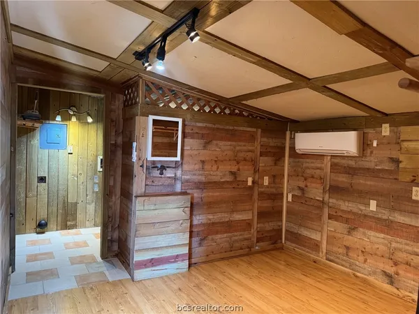 a bathroom with a shower and a sink