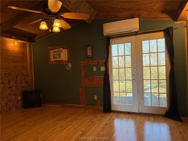 a view of empty room with a bathroom