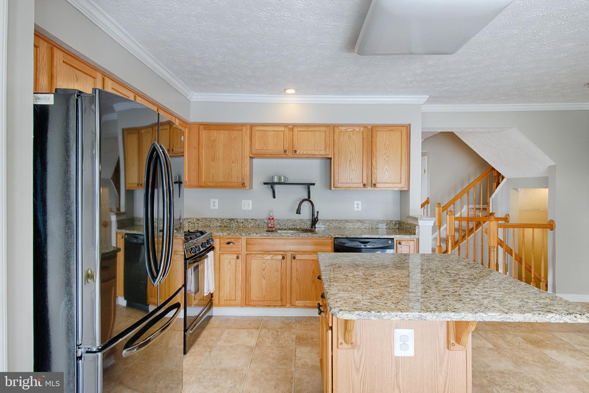 9817 Finsbury Road Baltimore, MD 21237 - Photo 7 of 36 Updated kit w rec'ed light, island, & granite tops