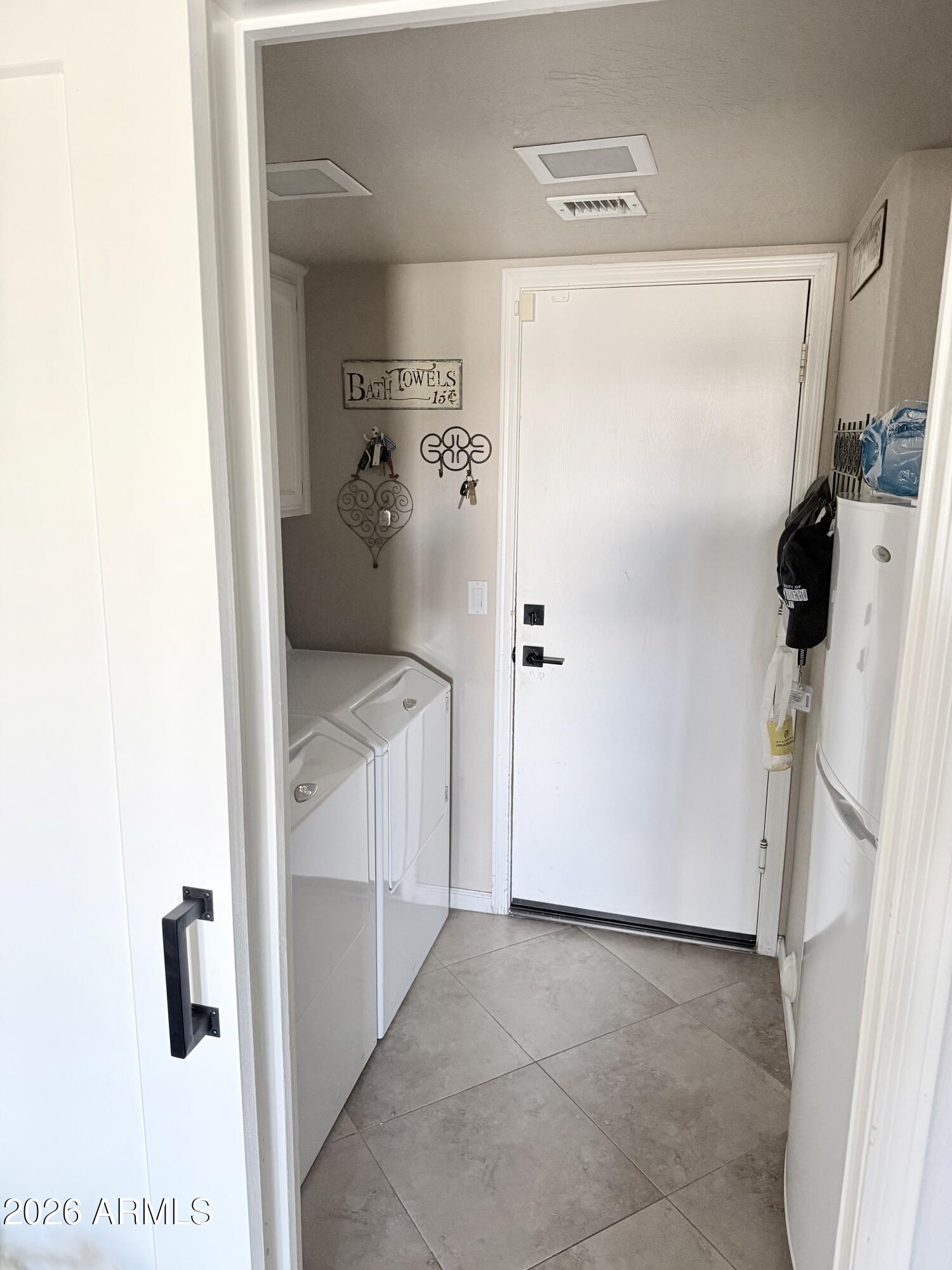 3426 East Clark Road Phoenix, AZ 85050 - Photo 18 of 48 a utility room with cabinets washer and dryer