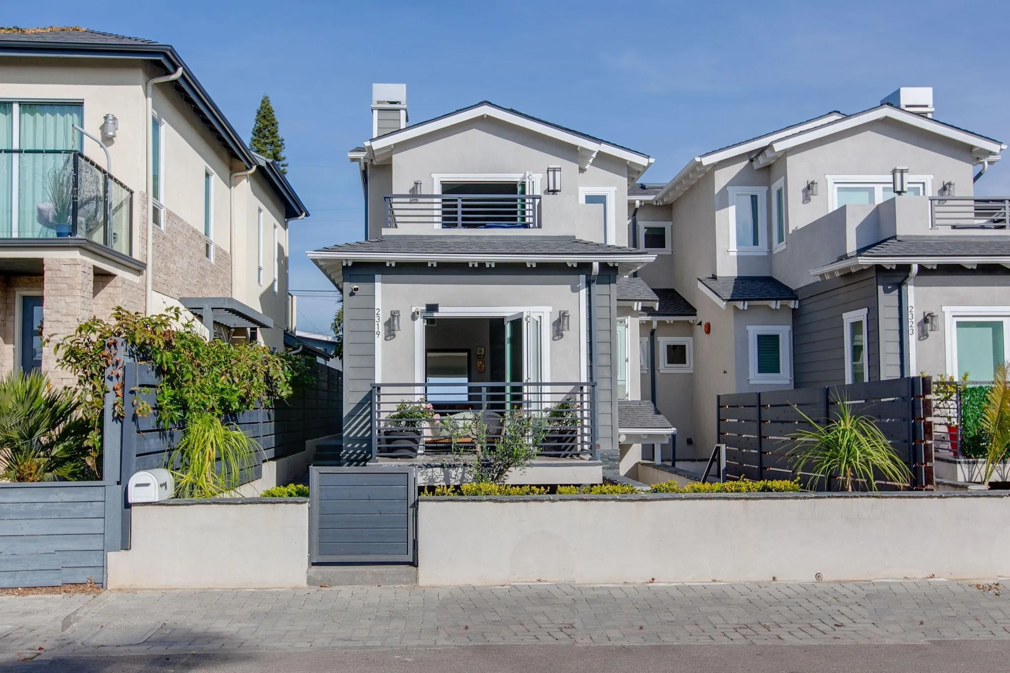 2319 Cambridge Avenue Cardiff, CA 92007 - Photo 1 of 48 a front view of a house with garage and plants