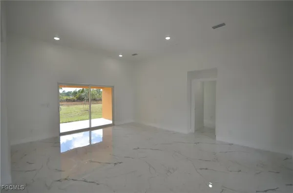 a view of an empty room with a sliding door