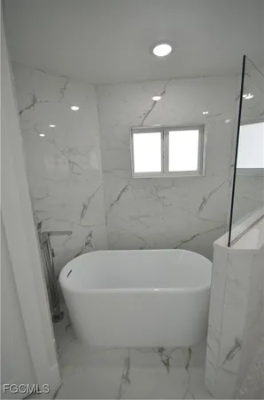 a bathroom with a double vanity sink and mirror
