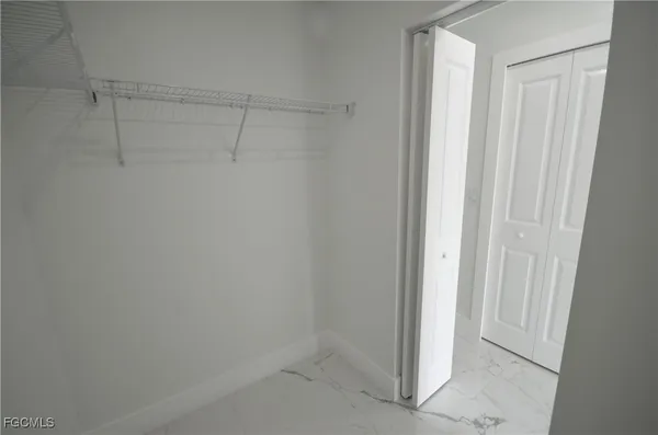 a view of a room with racks on the wall