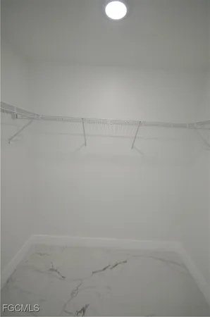 a bathroom with a toilet sink vanity and mirror