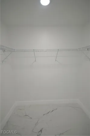 a bathroom with a toilet sink vanity and mirror