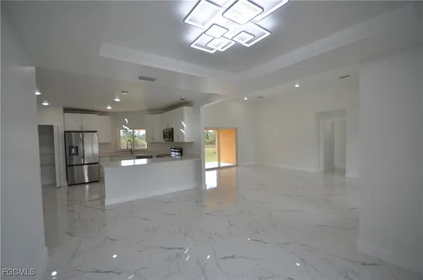 a view of a livingroom with a kitchen