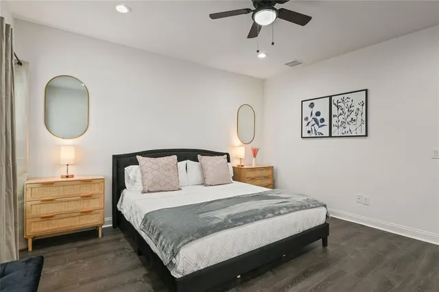 a bedroom with bed and a chandelier