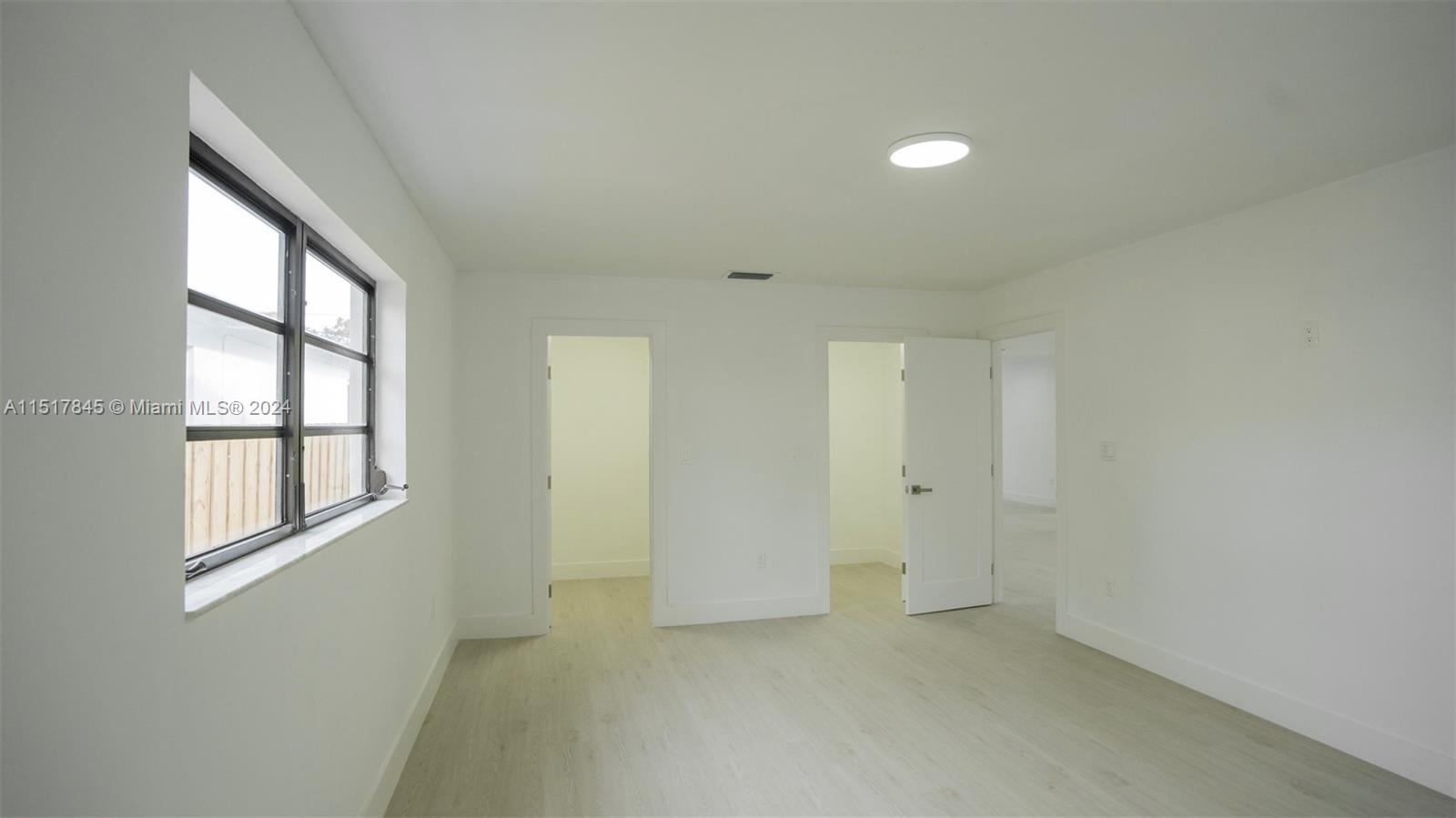 320 Southwest 66th Avenue Miami, FL 33144 - Photo 11 of 24 an empty room with windows and closet