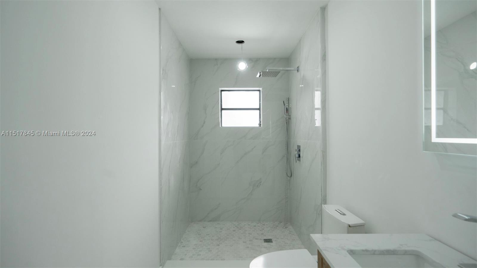 320 Southwest 66th Avenue Miami, FL 33144 - Photo 12 of 24 a bathroom with a shower room and toilet