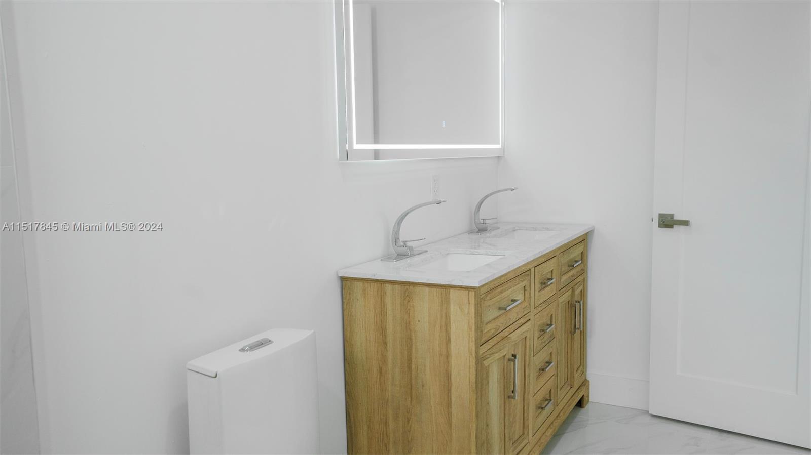 320 Southwest 66th Avenue Miami, FL 33144 - Photo 13 of 24 a bathroom with a sink and a mirror