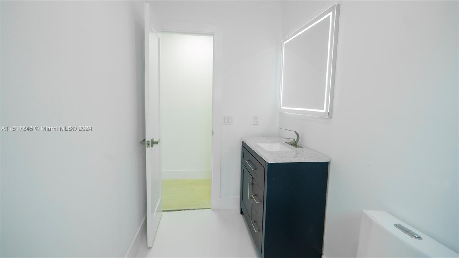 320 Southwest 66th Avenue Miami, FL 33144 - Photo 16 of 24 a bathroom with a sink and a mirror