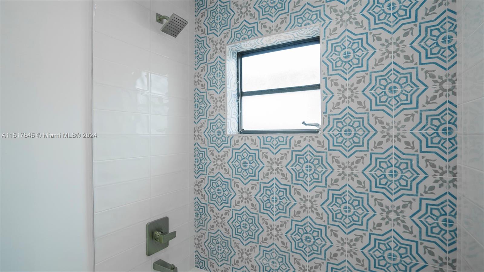 320 Southwest 66th Avenue Miami, FL 33144 - Photo 17 of 24 a bathroom with a shower and a window