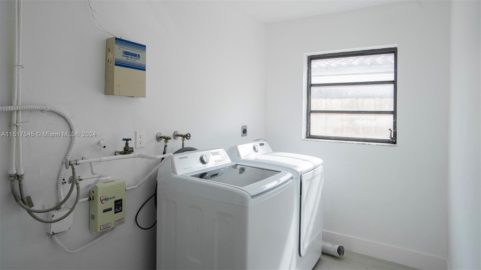 320 Southwest 66th Avenue Miami, FL 33144 - Photo 20 of 24 a utility room with dryer and washer