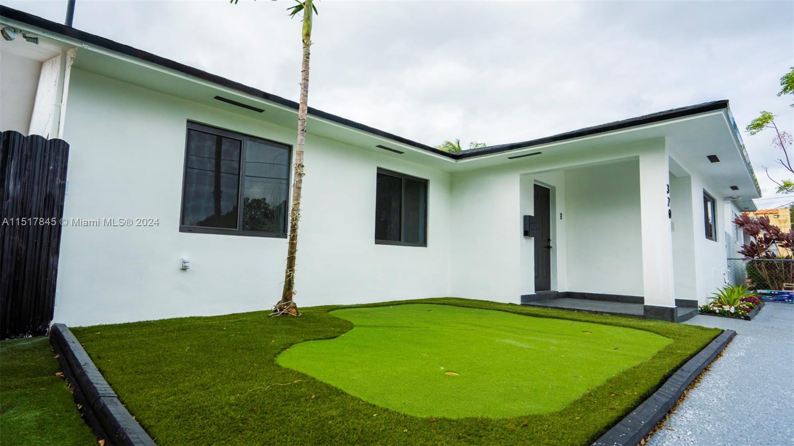 320 Southwest 66th Avenue Miami, FL 33144 - Photo 2 of 24 a view of a backyard with potted plants