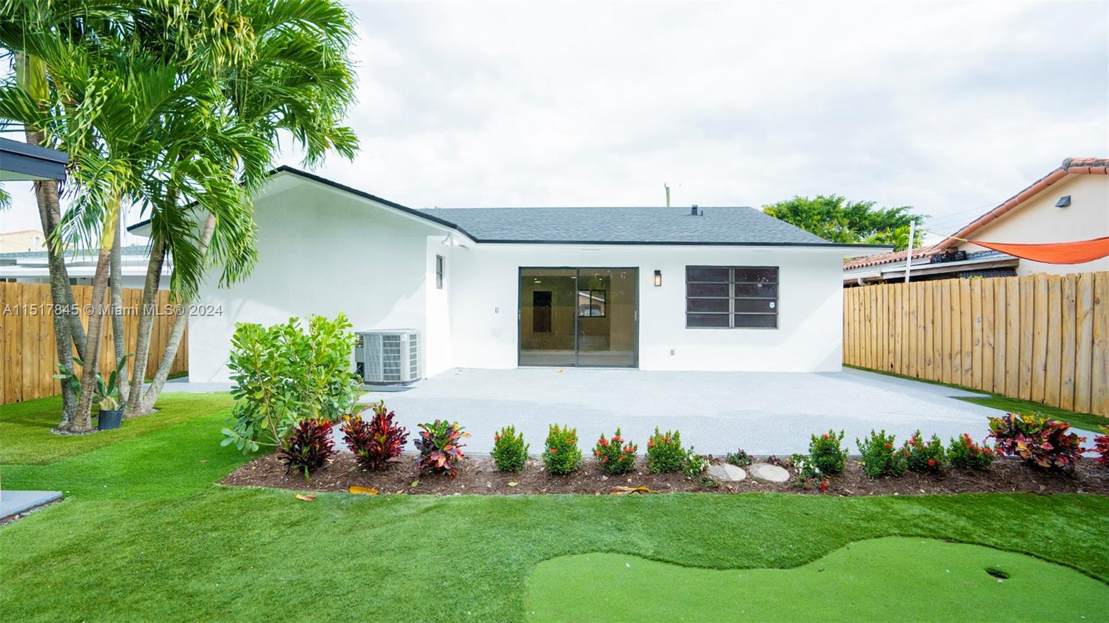 320 Southwest 66th Avenue Miami, FL 33144 - Photo 21 of 24 a front view of a house with garden