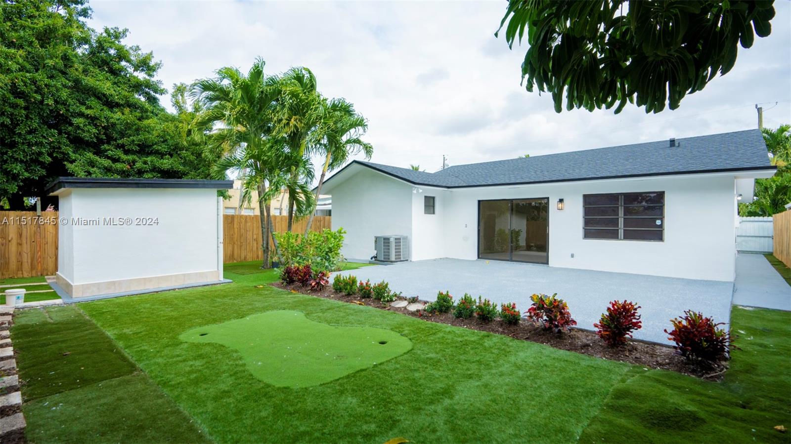 320 Southwest 66th Avenue Miami, FL 33144 - Photo 22 of 24 a front view of a house with a garden