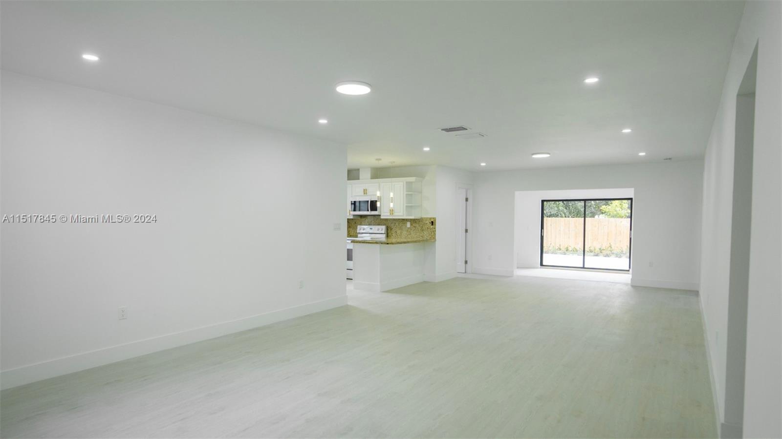 320 Southwest 66th Avenue Miami, FL 33144 - Photo 4 of 24 a view of an empty room with a window