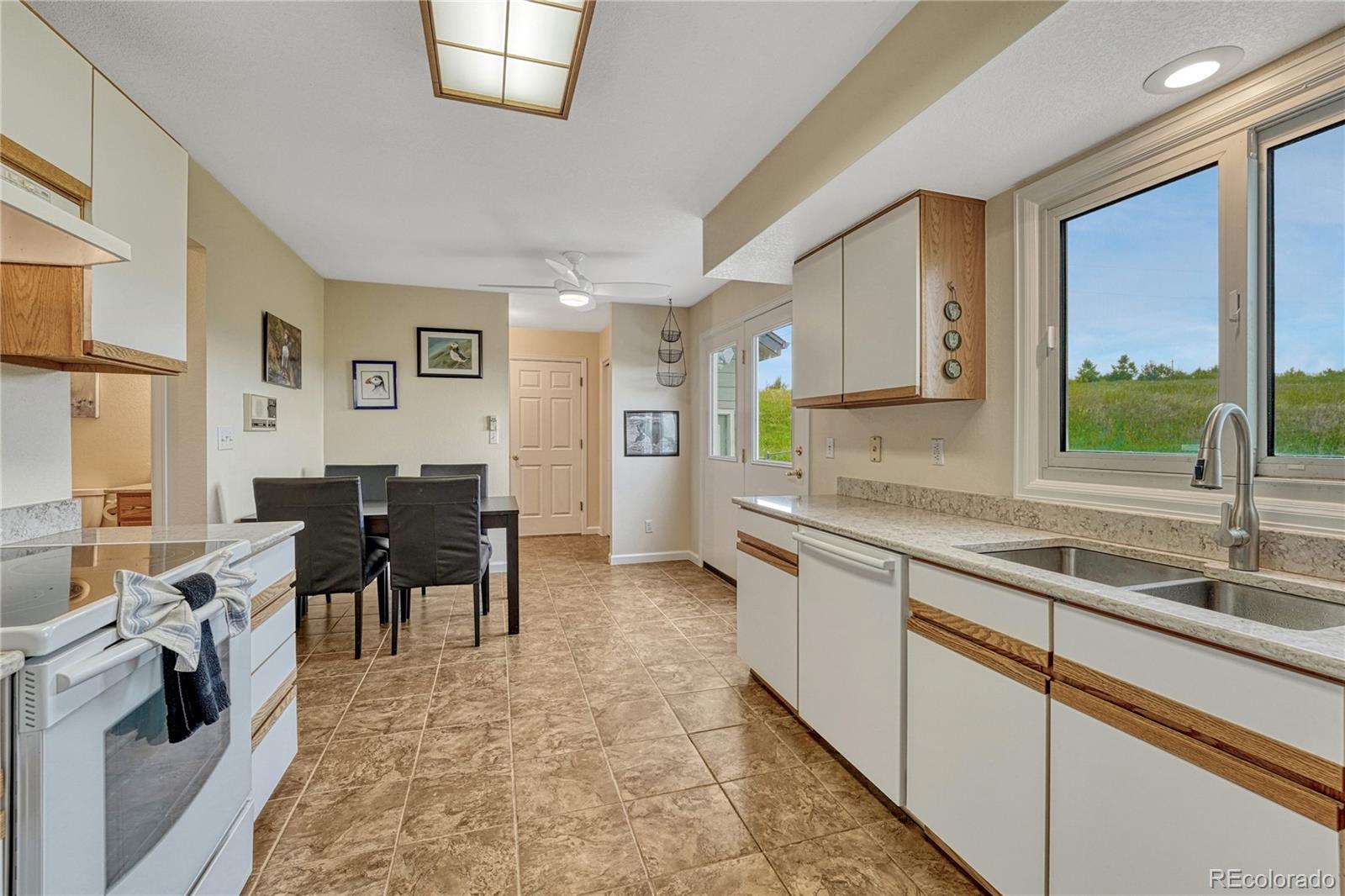 43793 Buckskin Road Parker, CO 80138 - Photo 15 of 50 a very nice looking kitchen with a large window