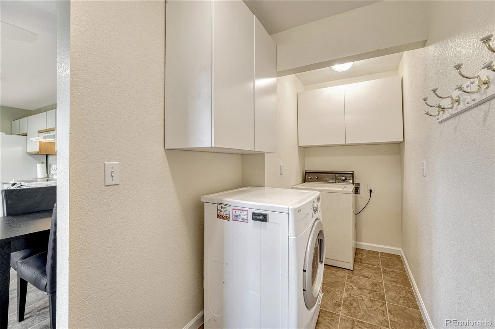 43793 Buckskin Road Parker, CO 80138 - Photo 18 of 50 a utility room with dryer and washer