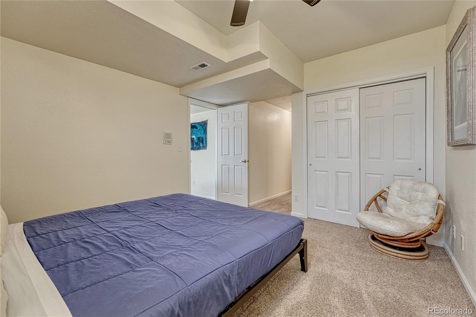 43793 Buckskin Road Parker, CO 80138 - Photo 37 of 50 a bedroom with a bed and a window