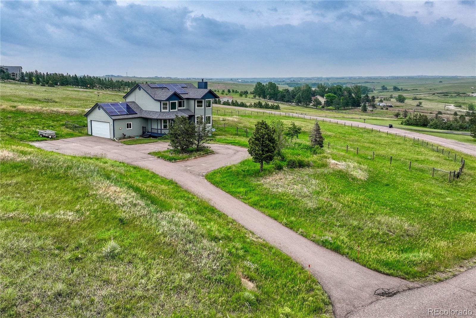 43793 Buckskin Road Parker, CO 80138 - Photo 43 of 50 a view of a garden with an outdoor seating