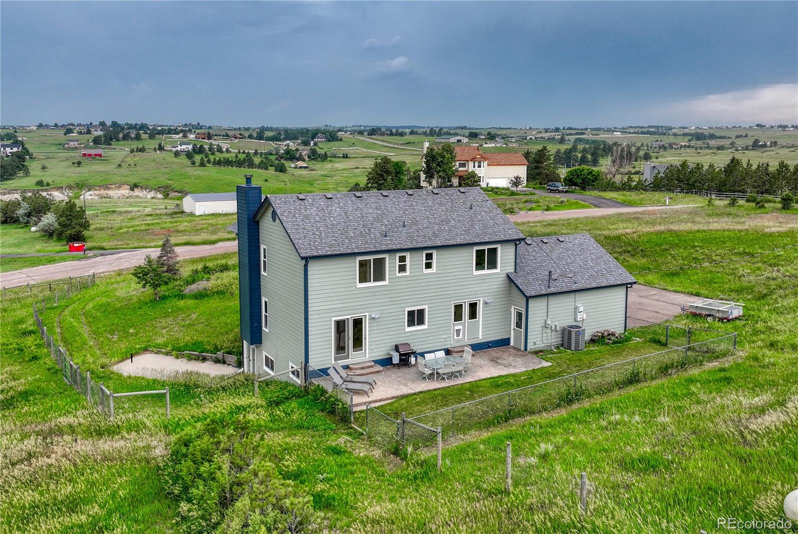 43793 Buckskin Road Parker, CO 80138 - Photo 46 of 50 an aerial view of a house with table and chairs