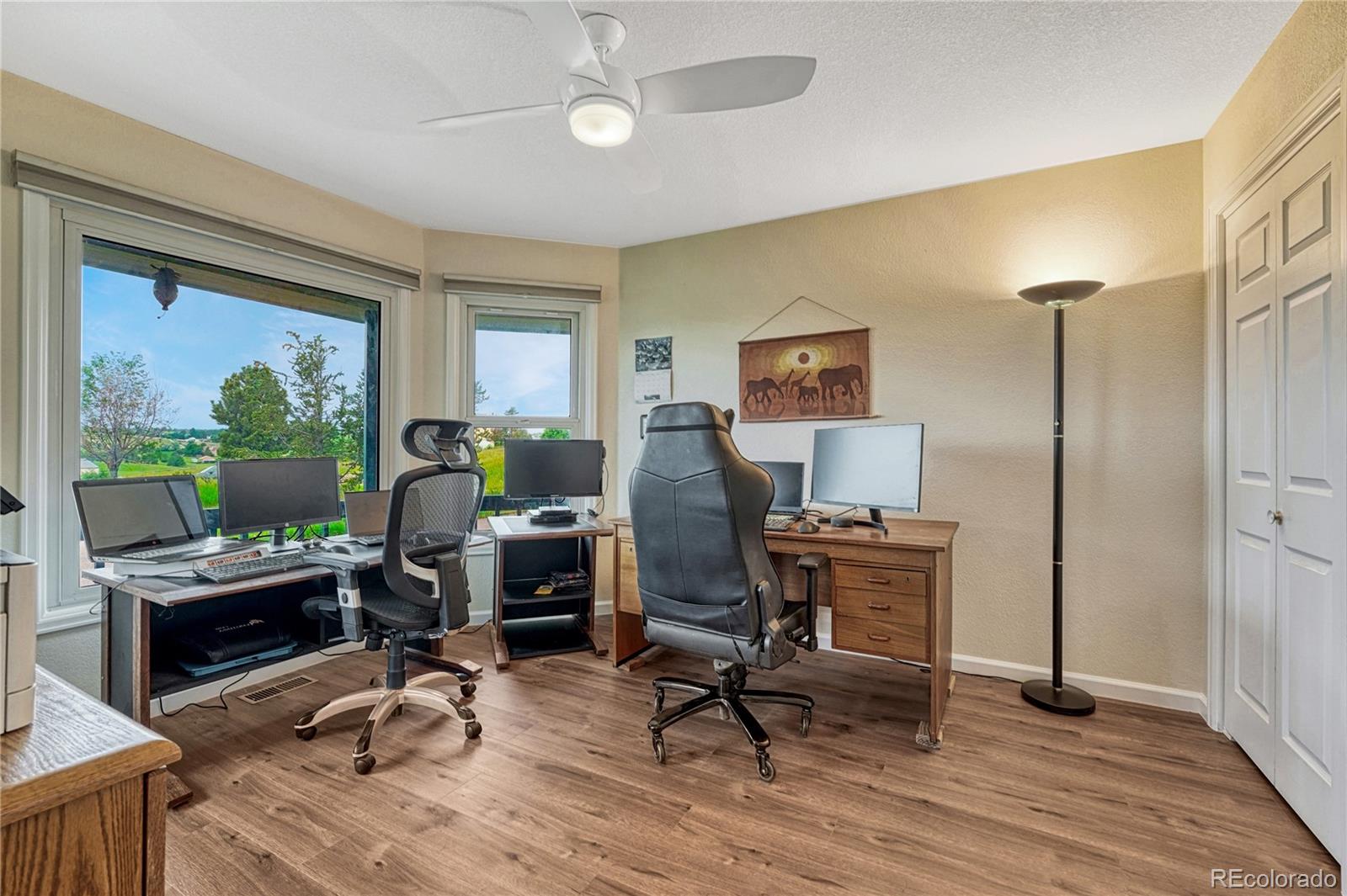 43793 Buckskin Road Parker, CO 80138 - Photo 6 of 50 a view of a workspace with furniture and a window