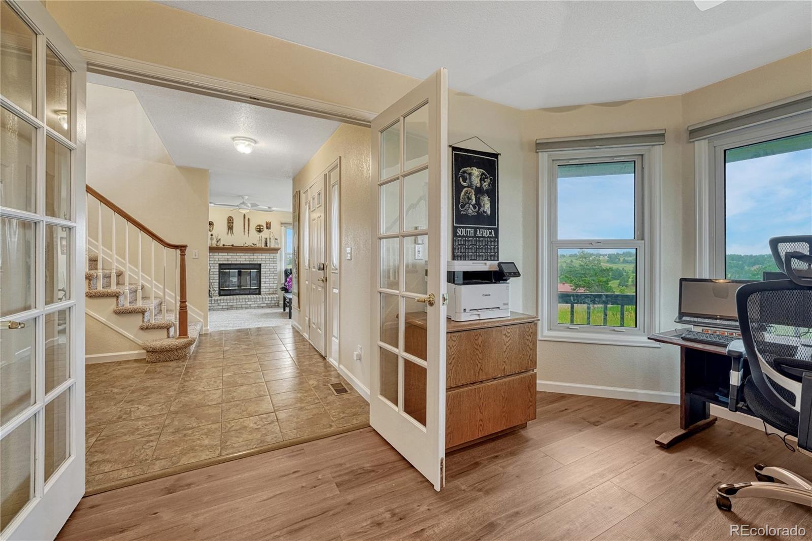 43793 Buckskin Road Parker, CO 80138 - Photo 7 of 50 a view of a workspace with furniture and a window