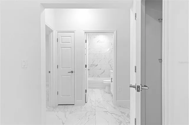 a view of a bathroom from the hallway