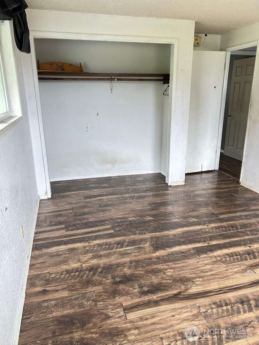 431 Highland Valley Road Morton, WA 98356 - Photo 19 of 34 a view of a room with wooden floor and stairs