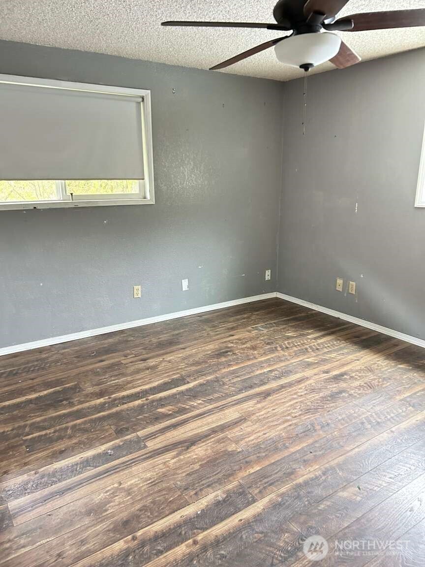 431 Highland Valley Road Morton, WA 98356 - Photo 21 of 34 a view of a room with a ceiling fan and wooden floor