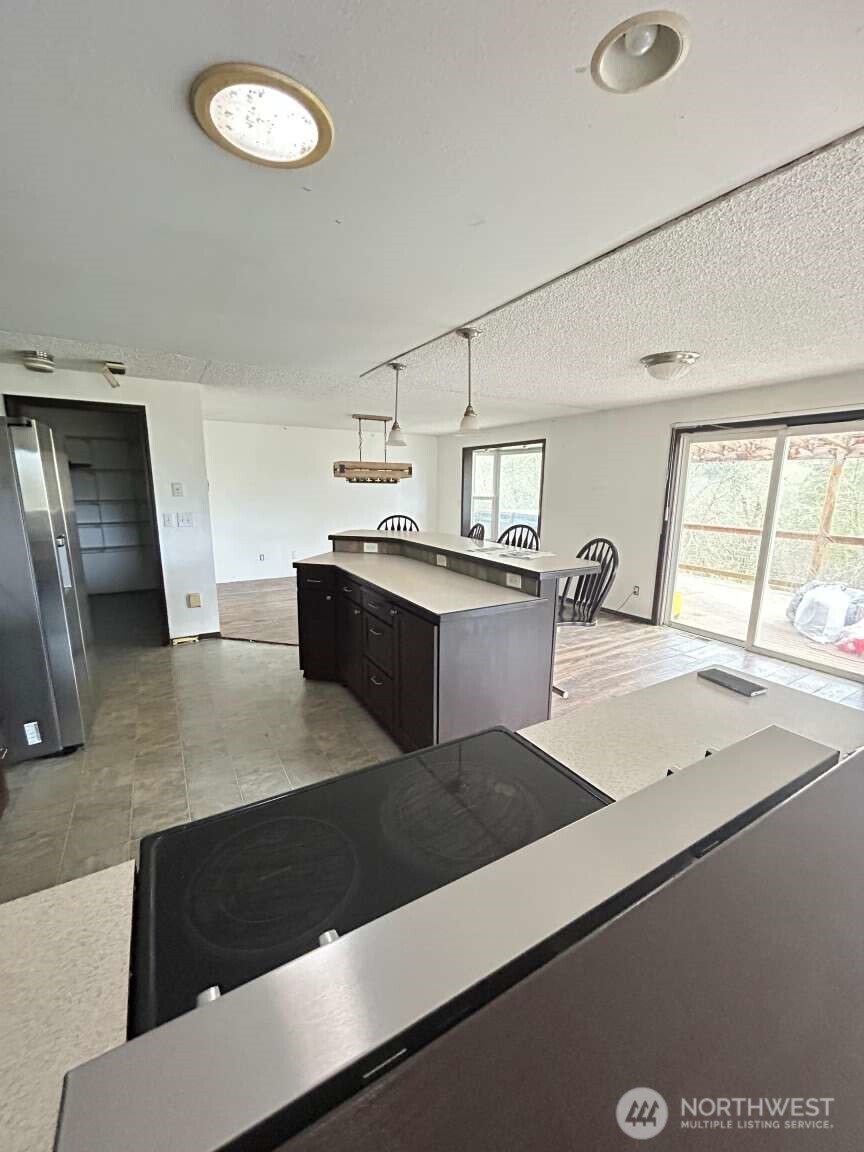 431 Highland Valley Road Morton, WA 98356 - Photo 31 of 34 a view of kitchen with stainless steel appliances granite countertop a sink and a stove