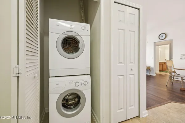a view of a hallway with washer and dryer