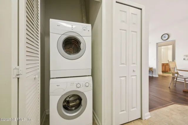 a view of a hallway with washer and dryer