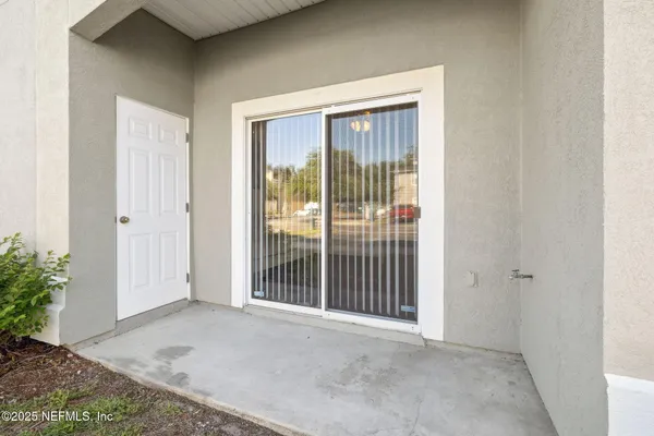a view of a room that has a large window