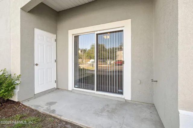 a view of a room that has a large window