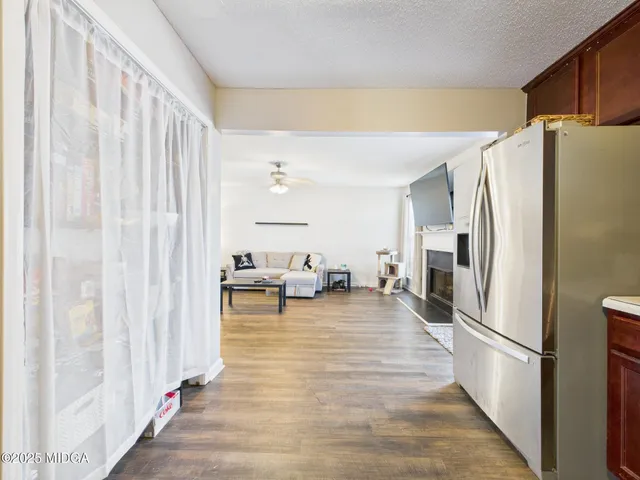 a bathroom with a toilet a sink a mirror and vanity