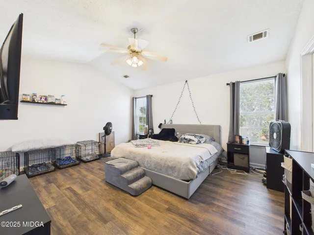 a bathroom with double vanity sink and a mirror