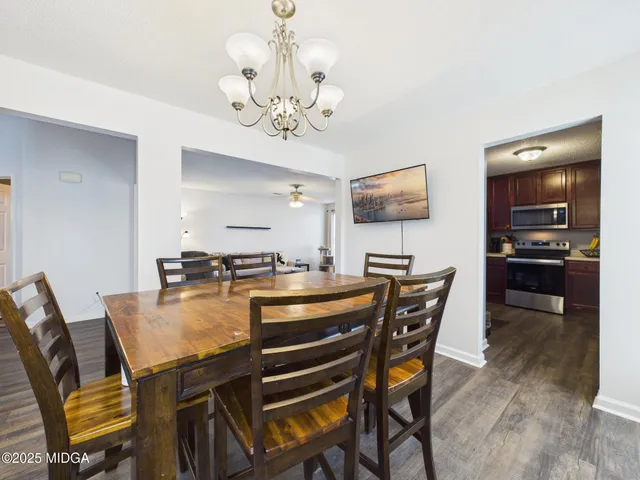 a kitchen with stainless steel appliances a refrigerator and a sink