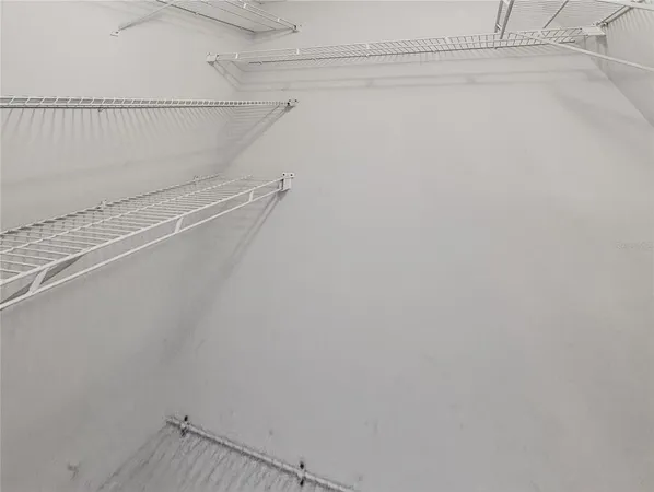 a view of a room with racks on the wall