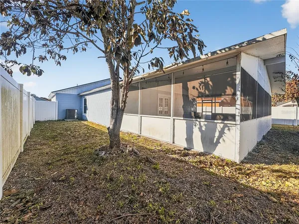 an aerial view of a house with a backyard